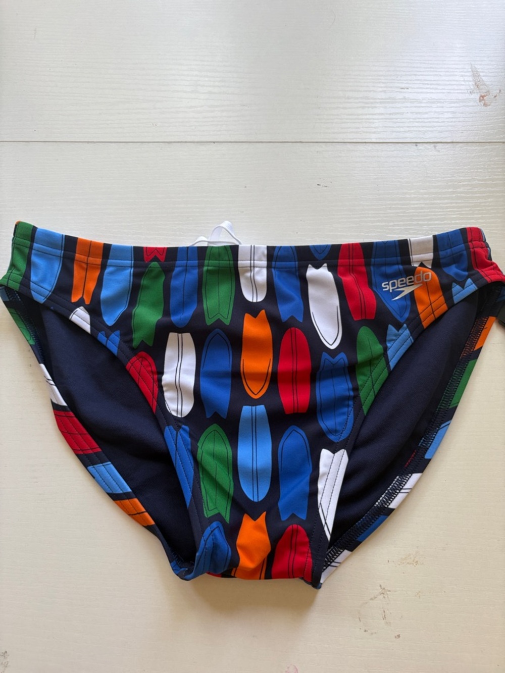 NWT Men’s Speedo swimsuit size 34. Navy base with surfboards